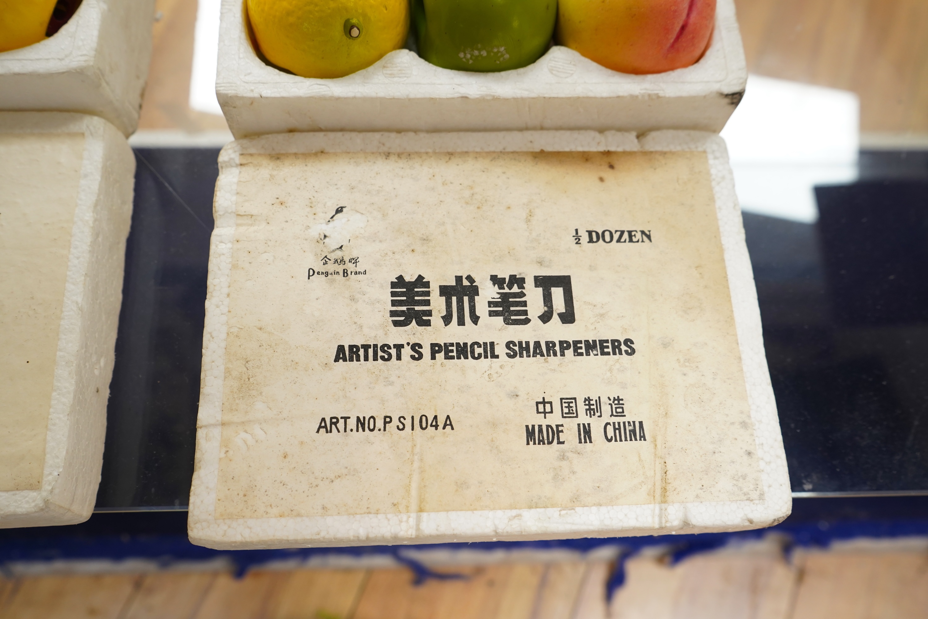 Two boxed sets of novelty Chinese Penguin Brand pencil sharpeners in the form of fruit
